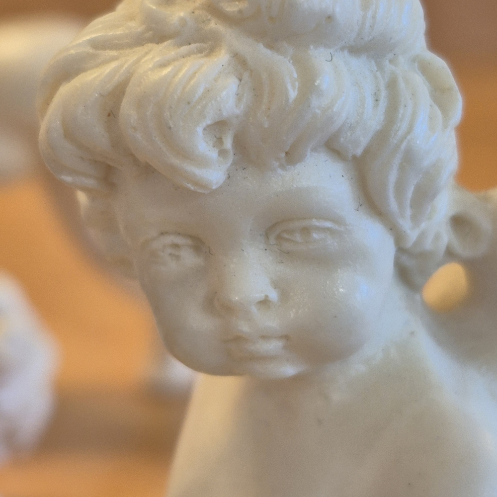 Elegant Santini Tumbling Cherub Sculptures From Italy